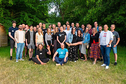 The +Pluswerk team at Pluscamp 2023 in the natural surroundings of the Knüllgebirge mountains