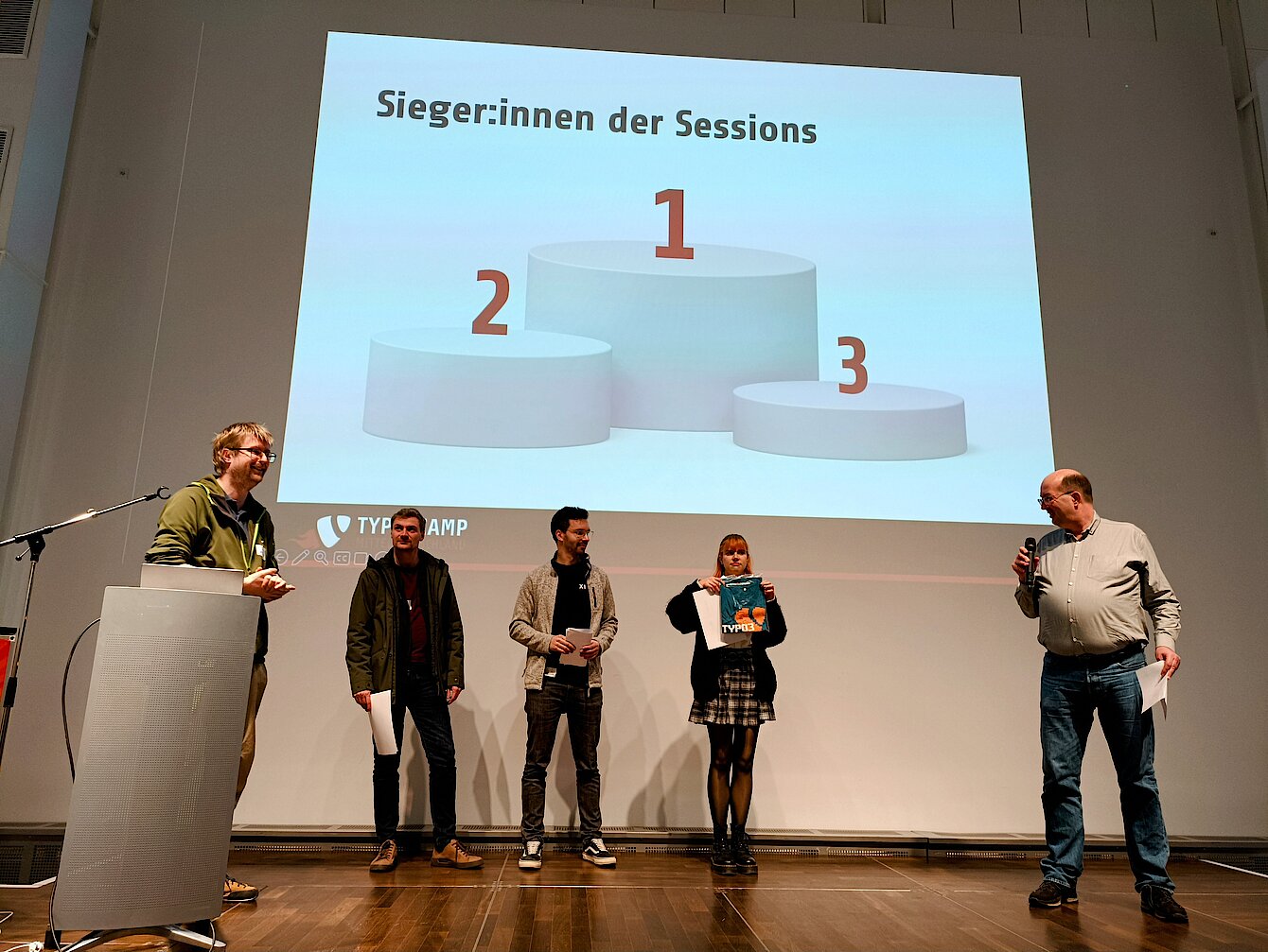 The winners of the "Best Session 2024" on stage at the TYPO3 Camp Central Germany